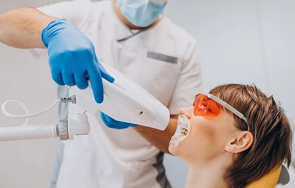 Patient receiving teeth whitening treatment